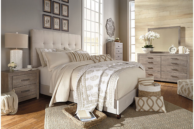 The Culverbach dresser's weathered driftwood finish evokes such an ethereal vibe—exactly what you need for your serene master suite. Clean lines and simple yet substantial hardware make for a timeless look you’ll love living with for years to come. Six spacious drawers offer ample storage for a wardrobe and spare bed linens.Dresser only | Made of engineered wood (MDF/particleboard) and decorative laminate | Warm vintage gray with subtle pearl effect over replicated cherry grain | Pewter-tone hardware | 6 smooth-gliding drawers with replicated linen lining | Includes tip over restraint device | Safety is a top priority, clothing storage units are designed to meet the most current standard for stability, ASTM F 2057 (ASTM International) | Drawers extend out to accommodate maximum access to drawer interior while maintaining safety