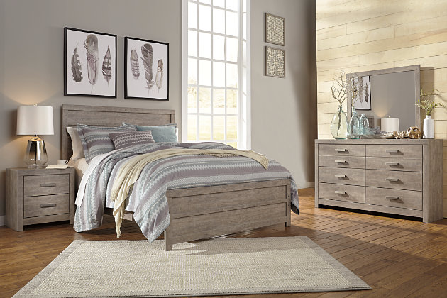 The Culverbach bedroom package’s weathered driftwood finish evokes such an ethereal vibe—exactly what you need for a serene bedroom suite. Chunky moulding on the bed creates a plank-like effect, while clean lines on all pieces in this set make for a timeless look you’ll love living with for years to come. Spacious drawers and simple yet substantial hardware offer ample stylish storage for your wardrobe.Includes queen panel bed (headboard, footboard and rails) and 6-drawer dresser with mirror | Made of engineered wood (MDF/particleboard) and decorative laminate | Warm gray vintage finish with subtle pearl effect over replicated cherry grain | Dresser with pewter-tone hardware | Dresser with smooth-gliding drawers with replicated linen lining | Mirror attaches to back of dresser | Mattress available, sold separately | Foundation/box spring required, sold separately | Includes tip over restraint device | Safety is a top priority, clothing storage units are designed to meet the most current standard for stability, ASTM F 2057 (ASTM International) | Drawers extend out to accommodate maximum access to drawer interior while maintaining safety | Assembly required | Estimated Assembly Time: 10 Minutes