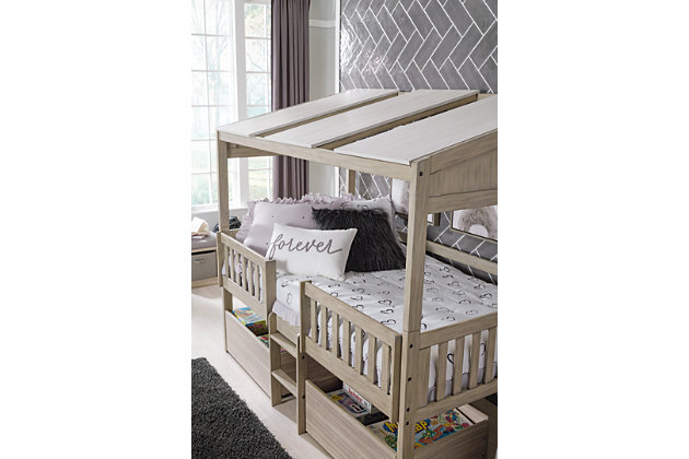 Here’s to a kid-friendly bed that blends in beautifully with modern farmhouse living. The Wrenalyn loft bed features a charming front porch railing effect, to help kids create a little home of their own. Coordinating under bed rolling storage bins are the perfect accompaniment to this contemporary bedroom suite.Bed frame and ladder made of solid wood | Panels and 2 underbed storage boxes made of engineered wood and decorative laminate | Replicated exotic wood grain in light tan natural wood coloration | Loft-style bed with roof panels and sturdy ladder | Top bunk with protective side rails | Under bed storage boxes with metal casters for easy mobility | Sturdy ladder leads to top bunk |  Included slats eliminate need for foundation/box spring |  Mattress available, sold separately |  The Consumer Product Safety Commission states that top bunks not be used for children under 6 years of age |  Assembly required | Estimated Assembly Time: 55 Minutes