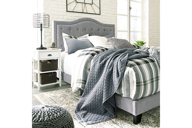 Set the scene for a heavenly bedroom retreat—at a down-to-earth price—with the Jerary queen upholstered bed. Light gray upholstery gracing the camelback-style tufted headboard, rails and low-profile footboard sports a textural weave that feels fresh and now. Engineered wood frame | Polyester upholstery | Button-tufted headboard | Packs complete in one box for Express Ship | Foundation/box spring required, sold separately | Mattress available, sold separately | Assembly required | Estimated Assembly Time: 45 Minutes
