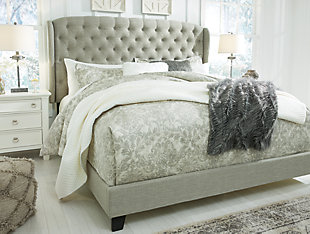 Set the scene for a heavenly bedroom retreat—at a down-to-earth price—with the Jerary queen upholstered bed. Light gray upholstery gracing the tufted headboard sports a textural weave that feels fresh and now. Modified wingback design gives the traditional profile a modern upgrade. Footboard and rails are also dressed in cool gray tones. Includes upholstered headboard, footboard and rails | Engineered wood frame | Polyester upholstery | Button-tufted headboard with modified wingback design | Wood feet with a dark brown finish | Foundation/box spring required, sold separately | Mattress available, sold separately | Assembly required | Estimated Assembly Time: 60 Minutes