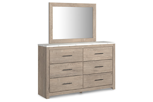 Cool, clean and casually modern. The Senniberg dresser and mirror's light natural finish and faux Calcutta marble top set the tone for your calming sanctuary. Large linear pulls add dimension and authenticity. Six smooth-gliding drawers neatly accommodate your wardrobe needs.Made of engineered wood (MDF/particleboard) and decorative laminate | Dry, light finish with replicated oak grain and authentic touch | Replicated Calcutta marble top | 6 smooth-gliding drawers with faux linen lining | Large scale dark colored handles | Mirror attaches to back of dresser | Assembly required | Estimated Assembly Time: 5 Minutes