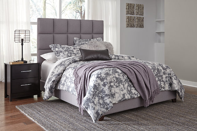 Serenity now. This queen upholstered bed is sure to awaken a love for modern platform styling with a softer side. Plush to the touch and so easy on the eyes, a dusty gray fabric hugs the bed—from the chic headboard with stitched square tufting, to the low footboard and side rails, emanating the calming mood you long for in the bedroom. Mattress and foundation/box spring sold separately.Engineered wood frame | Includes headboard, footboard and rails | Polyester upholstery on headboard, footboard and rails | Square tufting on headboard | Foundation/box spring required, sold separately | Mattress available, sold separately | Assembly required | Excluded from promotional discounts and coupons | All parts required for assembly of this bed are packed in the open space in the back of the headboard | Estimated Assembly Time: 60 Minutes