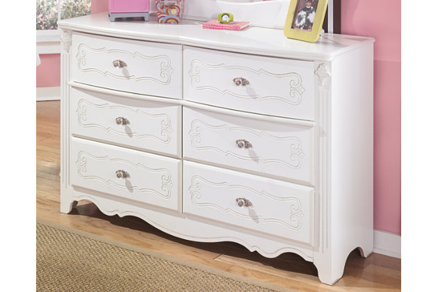 Inspired by French provincial style, the Exquisite dresser is perfect for la petite mademoiselle. Drawers are embossed with an eye-catching decorative motif that's très chic. Luminous finish complements every color of the rainbow.Dresser only | Made of engineered wood (MDF/particleboard) | Brushed nickel-tone hardware with faux crystal knobs | Ornamental fluted post | 6 drawers | Safety is a top priority, clothing storage units are designed to meet the most current standard for stability, ASTM F 2057 (ASTM International) | Drawers extend out to accommodate maximum access to drawer interior while maintaining safety