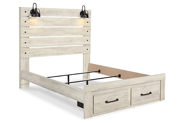 What a delightful take on rustic industrial style. Whether modern loft or modern farmhouse, the Cambeck queen panel storage bed makes itself at home. The wispy whitewash palette enhances without covering the grain for that weathered look you crave. Love to read in bed? You’re sure to find the retro-chic light sconces and USB plug-ins on the open-slat style headboard such a bright idea. Elongated metal drawer pulls on the footboard storage drawers elevate the aesthetic.Includes headboard, footboard and rails | Made of engineered wood and decorative laminate | Wispy white finish over replicated oak grain with authentic touch | Dark-tone industrial hardware | 2 decorative sconce lights, LED with 3 AA batteries | 2 smooth-gliding storage drawers | 2 slim-profile USB charging ports | Power cord included; UL-listed | Foundation/box spring required, sold separately | Mattress available, sold separately | Assembly required | Estimated Assembly Time: 10 Minutes