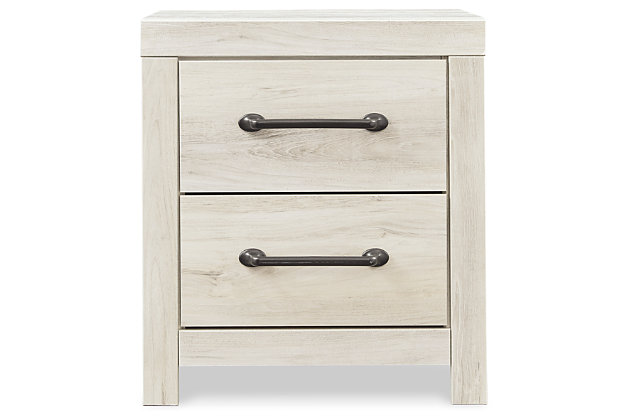 What a delightful take on rustic industrial style. Whether modern loft or modern farmhouse, the Cambeck nightstand makes itself at home. The wispy whitewash palette enhances without covering the grain for that weathered look you crave. Elongated drawer pulls elevate the aesthetic. Inclusion of USB plug-ins is such a bright idea.Made of engineered wood (MDF/particleboard) | and decorative laminate | Wispy white finish over replicated oak grain with authentic touch | Dark-tone industrial hardware | 2 smooth-gliding drawers | Drawers lined with faux linen laminate for finished aesthetic | 2 slim-profile USB charging stations | Power cord included; UL Listed