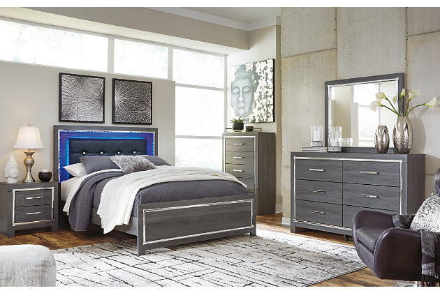 Reminiscent of Hollywood glamour of yesteryear, the Lodanna panel bed interprets luxury in a decidedly modern way. Sumptuous details include button-tufted upholstery, faceted faux crystals and chrome-tone accents beautiy lit by LED lights enhanced with remote-controlled settings for color and brightness.Includes headboard, footboard and side rails | Made of egineered wood (MDF/particleboard) and decorative laminate | Gray finish with replicated wood grain | Faux leather upholstery | Faux crystal and faceted chrome-tone metal accents | Accent LED lights with remote to control color and brightness | Power cord included; UL Listed | Foundation/box spring required, sold separately | Mattress available, sold separately | Assembly required | Estimated Assembly Time: 10 Minutes