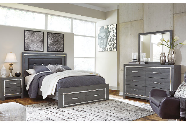 Reminiscent of Hollywood glamour of yesteryear, the Lodanna bedroom set with queen bed with storage, dresser/mirror and chest interprets luxury in a decidedly modern way. Headboard details include button-tufted upholstery, faceted faux crystals and LED lights enhanced with remote-controlled settings for color and brightness. Chrome-tone drawer pulls and accents are a chic complement to the dazzling gray finish.Includes panel bed (headboard, 2-drawer storage footboard and rails), 6-drawer dresser with mirror and 5-drawer chest | Made of engineered wood (MDF/particleboard) and decorative laminate | Gray finish with replicated wood grain | Dresser, chest and footboard with smooth-operating drawers; faceted chrome-tone pulls and accents | Bed with faux leather upholstery and faux crystal accents | Bed with accent LED lights with remote to control color and brightness | Power cord included; UL Listed | Mirror attaches to back of dresser | Foundation/box spring required, sold separately; mattress not included, sold separately | Safety is a top priority, clothing storage units are designed to meet the most current standard for stability, ASTM F 2057 (ASTM International) | Drawers extend out to accommodate maximum access to drawer interior while maintaining safety | Assembly required | Estimated Assembly Time: 15 Minutes
