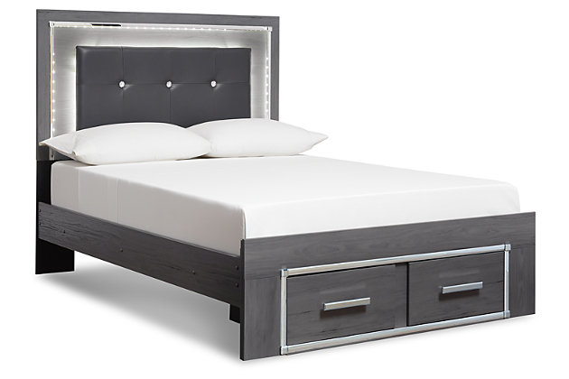 Reminiscent of Hollywood glamour of yesteryear, the Lodanna full storage bed interprets luxury in a decidedly modern way. Sumptuous details include button-tufted upholstery, faceted faux crystals and chrome-tone accents beautifully lit by LED lights enhanced with remote-controlled settings for color and brightness.Includes headboard, footboard and side rails | Made of egineered wood (MDF/particleboard) and decorative laminate | Gray finish with replicated wood grain | Faux leather upholstery | Faux crystal and faceted chrome-tone metal accents | Accent LED lights with remote to control color and brightness | 2 smooth operating drawers | Power cord included; UL Listed | Mattress and foundation/box spring available, sold separately | Assembly required | Estimated Assembly Time: 10 Minutes