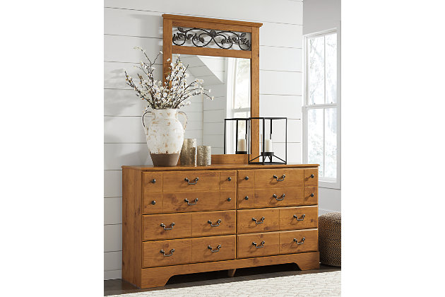 A fresh take on Early American country furniture. When it comes to style, the Bittersweet dresser and mirror set lets nature take its course with details including a brilliant replicated pine grain finish and antiqued brass-tone hardware. The mirror's touch of scrolled metal, made to look like wandering vine, is a naturally beautiful tie-in.Made of engineered wood (MDF/particleboard) and decorative laminate | Replicated rustic pine grain | Antique-brass-finish hardware | 6 drawers | Mirror attaches to back of dresser | Assembly required | Includes tipover restraint device | Estimated Assembly Time: 5 Minutes