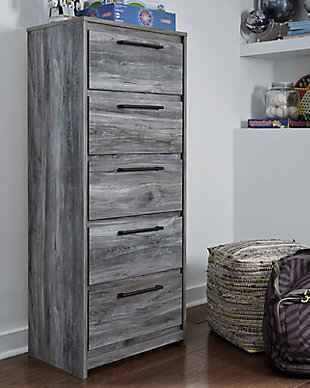 Beachy style and lots of storage go hand in hand with the Baystorm narrow chest. Its driftwood and surfer-inspired smoky finish creates a rustic look that's perfect for setting the scene of an island getaway. Five roomy drawers give you the space needed for stowing away clothes and more. Clean lines and modern handles provide an authentic look to be admired for years to come.Made of engineered wood (MDF/particleboard) and decorative laminate | Smoky gray finish over replicated oak grain with authentic touch | Linear pulls with antiqued gunmetal-tone finish | 5 smooth-gliding drawers | Drawer interiors are lined with a faux linen laminate for a clean, finished look | Safety is a top priority, clothing storage units are designed to meet the most current standard for stability, ASTM F 2057 (ASTM International) | Drawers extend out to accommodate maximum access to drawer interior while maintaining safety