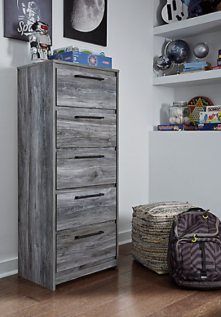 Beachy style and lots of storage go hand in hand with the Baystorm narrow chest. Its driftwood and surfer-inspired smoky finish creates a rustic look that's perfect for setting the scene of an island getaway. Five roomy drawers give you the space needed for stowing away clothes and more. Clean lines and modern handles provide an authentic look to be admired for years to come.Made of engineered wood (MDF/particleboard) and decorative laminate | Smoky gray finish over replicated oak grain with authentic touch | Linear pulls with antiqued gunmetal-tone finish | 5 smooth-gliding drawers | Drawer interiors are lined with a faux linen laminate for a clean, finished look | Safety is a top priority, clothing storage units are designed to meet the most current standard for stability, ASTM F 2057 (ASTM International) | Drawers extend out to accommodate maximum access to drawer interior while maintaining safety