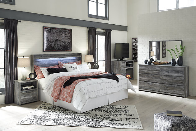 Rest in the beachy style of the Baystorm queen panel headboard. Its driftwood and surfer-inspired smoky finish gives any bed a rustic look that's perfect for creating an island escape in the room. Clean lines and modern charm blend for an authentic look to be enjoyed for years to come.Headboard only | Made of engineered wood (MDF/particleboard) and decorative laminate | Smoky gray finish over replicated oak grain with authentic touch | Assembly required