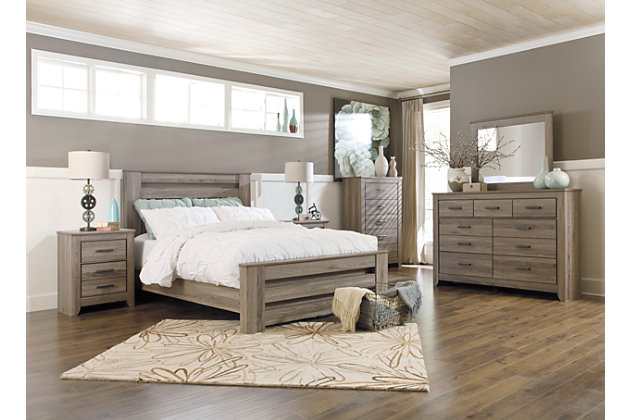 Urban sophistication with a decidedly relaxed air. If effortless elegance is the impression you’re going for, the Zelen 6-piece bedroom set is such a natural choice. Its crisp and contemporary aesthetic is softened with an earthy gray finish that lets the beauty of replicated oak grain flow through. The queen panel bed’s pocket plank styling offers great dimension. Dresser/mirror’s seven various size drawers cleverly accommodate. Nightstand with two smooth-gliding drawers of varied size make it a bedroom essential. Mattress and foundation/box spring available, sold separately.Bedroom set includes queen bed with headboard, footboard and rails; dresser, mirror and nightstand | Made of engineered wood | Gray, weathered finish over replicated oak grain | Pewter-tone hardware | Dresser with 7 smooth-operating drawers | Nighstand with 2 smooth-operating drawers | Mirror attaches to back of dresser | Mattress and foundation/box spring available, sold separately | Assembly required