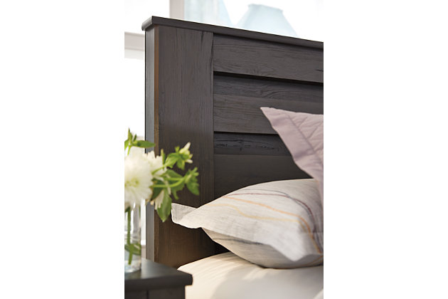 Priced to entice and styled to impress, the alluring Brinxton queen headboard is urban sophistication with a decidedly relaxed air. It’s got the crisp, clean lines of a contemporary piece, but with an earthy element. Deep, horizontal grooves infuse depth and dimension, while a replicated oak grain effect gives the charcoal gray finish warmth and character.Headboard only | Hardware not included | Made of engineered wood and decorative laminate | Dark charcoal finish over replicated oak grain | ¼" bolts are needed to attach headboard to existing bed frame | Bolt length depends on thickness of your bed frame | Assembly required