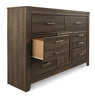 Get the look of posh barn wood without setting foot in a salvage yard. Replicated rough-sawn oak of the Juararo dresser and mirror set has a vintage finish that is reminiscent of a timeworn family heirloom. Warm, rustic and naturally beautiful, it’s just got that ageless appeal. Sleek, mod pulls in a pewter tone are a snappy finishing touch.Made of engineered wood and decorative laminate | Vintage aged brown rough sawn finish over replicated oak grain | Pewter-tone hardware | 6 drawers | 1 cabinet with 1 adjustable shelf | Mirror attaches to back of dresser | Safety is a top priority, clothing storage units are designed to meet the most current standard for stability, ASTM F 2057 (ASTM International) | Drawers extend out to accommodate maximum access to drawer interior while maintaining safety | Assembly required | Estimated Assembly Time: 5 Minutes