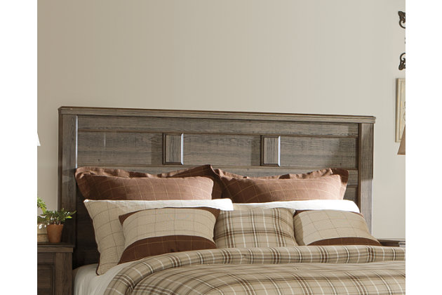 Get the look of posh barn wood without setting foot in a salvage yard. Replicated rough-sawn oak of the Juararo queen panel headboard has a vintage finish that is reminiscent of a timeworn family heirloom. Warm, rustic and naturally beautiful, it’s just got that ageless appeal.Headboard only | Made with engineered wood (MDF/particleboard) and decorative laminate | Vintage aged brown rough sawn finish over replicated oak grain | ¼” bolts are needed to attach headboard to existing bed frame | Bolt length depends on thickness of your bed frame | Assembly required