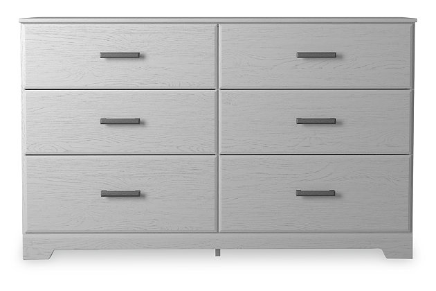 With its clean-lined look and modern attitude, the Stelsie dresser is a fresh style awakening. Crisp, white hue over subtle replicated wood grain easily complements other furniture finishes. Smooth drawer fronts with antiqued pewter-tone handles completes the aesthetic.Dresser only | Made with engineered wood (MDF/particleboard) and decorative laminate | White painted finish with subtle replicated wood grain with authentic touch | Antiqued pewter-tone handles | 6 smooth-gliding drawers | Safety is a top priority, clothing storage units are designed to meet the most current standard for stability, ASTM F 2057 (ASTM International) | Drawers extend out to accommodate maximum access to drawer interior while maintaining safety