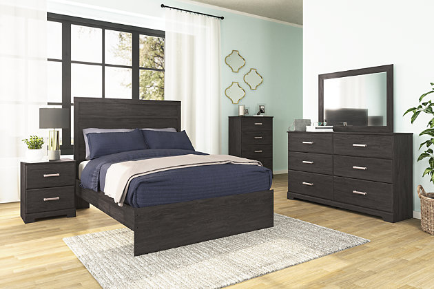 With its clean-lined look and modern attitude, the Belachime dresser and mirror is a fresh style awakening. Warm charcoal hue over replicated oak grain easily complements other furniture finishes. Smooth drawer fronts with antiqued pewter-tone handles completes the aesthetic.Made of engineered wood (MDF/particleboard) and decorative laminate | Dark charcoal finish over replicated oak grain with authentic touch | 6 smooth-gliding drawers | Antiqued dark pewter-tone handles | Mirror attaches to back of dresser | Safety is a top priority, clothing storage units are designed to meet the most current standard for stability, ASTM F 2057 (ASTM International) | Drawers extend out to accommodate maximum access to drawer interior while maintaining safety | Assembly required | Estimated Assembly Time: 5 Minutes