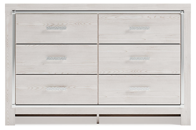 The epitome of fashion-forward design, the Altyra dresser is a beautiful blend of style and luxury. Shiny chrome-tone accents, a pearlized finish and mosiac pulls bring a glam touch to the richly rustic appearance. Six smooth-gliding drawers provide plenty of storage space for your wardrobe needs.Dresser only | Made of engineered wood (MDF/particleboard) and decorative laminate | Light finish with subtle pearl effect over replicated cedar grain with authentic touch | Large scale chrome-tone handles with mosaic details | Faceted chrome-tone accents | Six smooth-gliding drawers with faux linen lining | Safety is a top priority, clothing storage units are designed to meet the most current standard for stability, ASTM F 2057 (ASTM International) | Drawers extend out to accommodate maximum access to drawer interior while maintaining safety