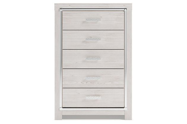 The epitome of fashion-forward design, the Altyra chest of drawers is a beautiful blend of style and luxury. Shiny chrome-tone accents, a pearlized finish and mosiac pulls bring a glam touch to the richly rustic appearance. Five smooth-gliding drawers provide plenty of storage space for your wardrobe needs.Made of engineered wood (MDF/particleboard) and decorative laminate | Light finish with subtle pearl effect over replicated cedar grain with authentic touch | Large scale chrome-tone handles with mosaic details | Faceted chrome-tone accents | Five smooth-gliding drawers with faux linen lining | Safety is a top priority, clothing storage units are designed to meet the most current standard for stability, ASTM F 2057 (ASTM International) | Drawers extend out to accommodate maximum access to drawer interior while maintaining safety