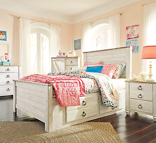 The Willowton panel bed with storage is the ultimate statement piece for a coastal cottage or shabby chic inspired retreat. Whitewashed finish is wondery easy on the eyes. Plank-style cap rails on the headboard and footboard infuse a driftwoody look that has our minds drifting away to beachy-keen escapes. Pair of smooth-gliding drawers keeps linens, blankets and jammies close at hand. Mattresses available, sold separately.Assembly required | Mattresses available, sold separately | Included slats eliminate need for foundation/box spring | Antiqued brass-tone ring-pull hardware | Plank styling | Whitewashed finish over replicated grain | Includes headboard, footboard, roll slats and underbed storage (2 smooth-operating drawers with side rail) | Made of engineered wood