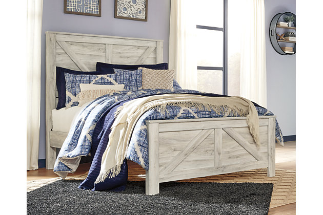 It’s gorgeous, it’s modern farmhouse, it’s the Bellaby crossbuck panel bed. Wispy, whitewash finish infuses so much character without mas the grain for that weathered, rustic look you crave. Clean-lined, classic panel styling provides a country chic bedroom retreat that’s a breath of fresh air. Mattress and foundation/box spring available, sold separately.Includes headboard, footboard and rails  | Made of engineered wood (MDF/particleboard) and decorative laminate | Wispy white finish over replicated oak grain with authentic touch | Foundation/box spring required, sold separately | Mattress available, sold separately | Assembly required | Estimated Assembly Time: 10 Minutes