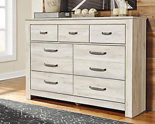 Your bedroom isn’t just a room. It’s a canvas. Express your farmhouse style with the Bellaby dresser. Wispy white finish over replicated oak wood grain brightens up the space with charm. Brushed nickel-tone handles with black edging finesse the piece with a bit of shine. Drawers are spacious and lined with faux linen laminate to hold your belongings with care. This clean-lined profile is the perfect authentic foundation for inviting decor.Dresser only | Made of engineered wood (MDF/particleboard) and decorative laminate | Wispy white finish over replicated oak grain with authentic touch | Brushed nickel-tone hardware with black edging | 7 smooth-gliding drawers (lined with faux linen laminate) | Safety is a top priority, clothing storage units are designed to meet the most current standard for stability, ASTM F 2057 (ASTM International) | Drawers extend out to accommodate maximum access to drawer interior while maintaining safety | Assembly required