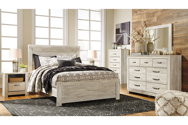 Your bedroom isn’t just a room. It’s a canvas. Express your farmhouse style with the Bellaby chest of drawers. Wispy white finish over replicated oak wood grain brightens up the space with charm. Brushed nickel-tone handles with black edging finesse the piece with a bit of shine. Drawers are spacious and lined with faux linen laminate to hold your belongings with care. This clean-lined profile is the perfect authentic foundation for inviting decor.Made of engineered wood and decorative laminate | Wispy white finish over replicated oak grain with authentic touch | Brushed nickel-tone hardware with black edging | 5 smooth-gliding drawers (lined with faux linen laminate) | Safety is a top priority, clothing storage units are designed to meet the most current standard for stability, ASTM F 2057 (ASTM International) | Drawers extend out to accommodate maximum access to drawer interior while maintaining safety | Assembly required