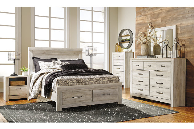 Your bedroom isn’t just a room. It’s a canvas. Express your farmhouse style with the Bellaby nightstand. Wispy white finish over replicated oak wood grain brightens up the space with charm. Brushed nickel-tone handles with black edging finesse the piece with a bit of shine. Drawer is spacious and lined with faux linen laminate to hold your belongings with care. This clean-lined profile is the perfect authentic foundation for inviting decor.Made of engineered wood (MDF/particleboard) and decorative laminate | Wispy white finish over replicated oak grain with authentic touch | 1 storage cubby | 1 smooth-gliding drawer (lined with faux linen laminate) | Brushed nickel-tone hardware with black edging | Slim-profile USB charging station | Power cord included; UL Listed | Assembly required