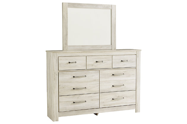 Your bedroom isn’t just a room. It’s a canvas. Express your farmhouse style with the Bellaby dresser and mirror set. Wispy white finish over replicated oak wood grain brightens up the space with charm. Brushed nickel-tone handles with black edging finesse the piece with a bit of shine. Drawers are spacious and lined with faux linen laminate to hold your belongings with care. This clean-lined profile is the perfect authentic foundation for inviting decor.Includes dresser and mirror | Made of engineered wood (MDF/particleboard) and decorative laminate | Wispy white finish over replicated oak grain with authentic touch | Brushed nickel-tone hardware with black edging | 7 smooth-gliding drawers (lined with faux linen laminate) | Mirror attaches to back of dresser | Safety is a top priority, clothing storage units are designed to meet the most current standard for stability, ASTM F 2057 (ASTM International) | Drawers extend out to accommodate maximum access to drawer interior while maintaining safety | Assembly required | Estimated Assembly Time: 5 Minutes