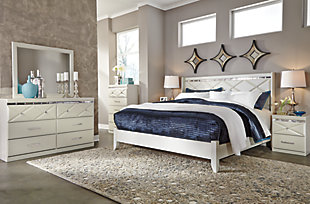 Love sleek and bold contemporary style? Live the dream with the Dreamur dresser. Eye-catching details include 3D pressed top drawers with beveled mirror banding. Faux crystal accented handles and knobs incorporate an added touch of sheen and shine.Dresser only | Made of engineered wood (MDF/particleboard) | Mirrored banding | Faux crystal hardware | 6 smooth-operating drawers | Includes tipover restraint device | Safety is a top priority, clothing storage units are designed to meet the most current standard for stability, ASTM F 2057 (ASTM International) | Drawers extend out to accommodate maximum access to drawer interior while maintaining safety