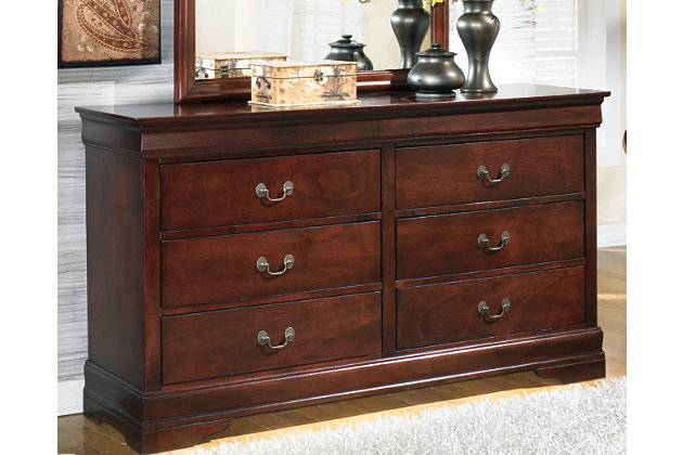 The Alisdair dresser is the epitome of traditional decor. Louis Philippe-style moulding dates back to the mid-19th century when furnishings were lavish yet somewhat simple. Deep finish brings warmth and elegance into the space.Dresser only | Made of engineered wood | Antique bronze-tone hardware | Louis Philippe-style moulding | 6 drawers with metal slides positioned beneath drawers | Excluded from promotional discounts and coupons | Includes tipover restraint device