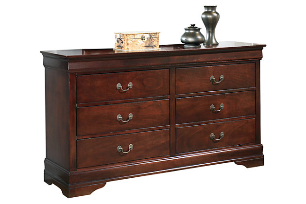 The Alisdair dresser is the epitome of traditional decor. Louis Philippe-style moulding dates back to the mid-19th century when furnishings were lavish yet somewhat simple. Deep finish brings warmth and elegance into the space.Dresser only | Made of engineered wood | Antique bronze-tone hardware | Louis Philippe-style moulding | 6 drawers with metal slides positioned beneath drawers | Excluded from promotional discounts and coupons | Includes tipover restraint device