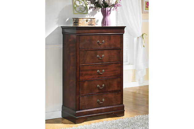 The Alisdair chest of drawers is the epitome of traditional decor. Louis Philippe-style moulding dates back to the mid-19th century when furnishings were lavish yet somewhat simple. Deep finish brings warmth and elegance into the space.Made of engineered wood | Antiqued bronze-tone hardware | 5 drawers with metal slides positioned beneath drawers | Louis Philippe-style moulding | Includes tipover restraint device | Small Space Solution