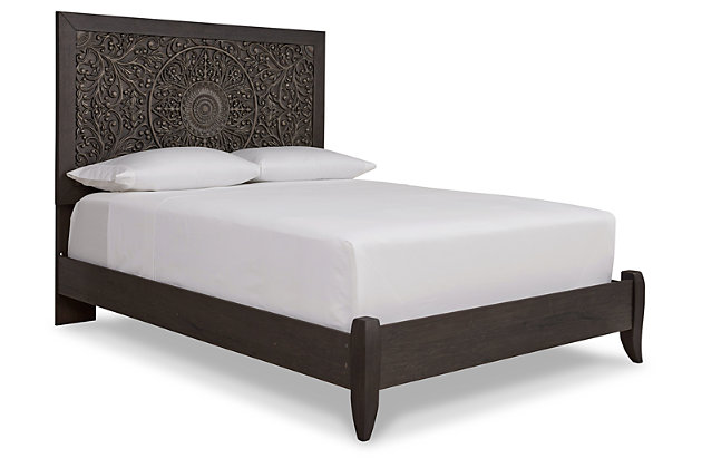 Showcase your trend-setting spirit with the Paxberry panel bed. Inspired by bohemian tapestries, exquisite carved medallion pattern is a testament to boho-chic style. Sophisticated dark finish sets a foundation for a room bursting with personality. Includes headboard and footboard with rails | Made of engineered wood (MDF/particleboard) and decorative laminate | Vintage aged black/brown finish over replicated oak grain | Foundation/box spring required, sold separately | Mattress available, sold separately | Assembly required | Estimated Assembly Time: 5 Minutes