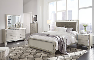 Taking its cues from Hollywood Regency interiors, the Lonnix queen upholstered bed is puttin’ on the ritz in a big way. The bed’s ultra-clean profile is elevated with a spectacular metallic silvertone finish, enriched with a hint of embossed texturing on the low-profile footboard. Tufted headboard is adorned with a low-maintenance gray faux leather fabric that’s as plush as it is practical. And for a dazzling effect: beveled mirror trim surrounding the upholstered cushion that’s brought to life by a string of LED lighting. Mattress and foundation/box spring available, sold separately.Made of wood and engineered wood | Includes headboard, footboard and rails | Silvertone metallic finish | Button-tufted faux leather upholstery  | LED backlights for ambiance | Power cord included; UL Listed | Beveled mirror trim | Embossed, textural panels | Assembly required | Mattress and foundation/box spring available, sold separately | Estimated Assembly Time: 55 Minutes