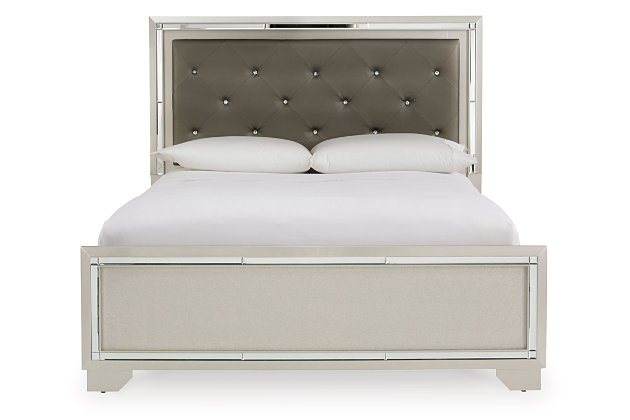 Ta its cues from Hollywood Regency interiors, the Lonnix upholstered bed is puttin’ on the ritz in a big way. The bed’s ultra-clean profile is elevated with a spectacular metallic silvertone finish, enriched with a hint of embossed texturing on the low-profile footboard. Tufted headboard is adorned with a low-maintenance gray faux leather fabric that’s as plush as it is practical. And for a dazzling effect: beveled mirror trim surrounding the upholstered cushion that’s brought to life by a string of LED lighting. Mattress and foundation/box spring available, sold separately.Made of wood and engineered wood | Includes headboard, footboard and rails | Silvertone metallic finish | Button-tufted faux leather upholstery  | LED backlights for ambiance | Power cord included; UL Listed | Beveled mirror trim | Embossed, textural panels | Assembly required | Mattress and foundation/box spring available, sold separately | Estimated Assembly Time: 55 Minutes