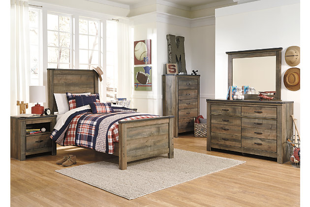 Whether she loves horses or he's a cowboy at heart, the Trinell nightstand matches their authenticity. Rustic finish, plank-style details and nailhead trim pay homage to reclaimed barn wood, making for a chic look loaded with charm. An included charging station for tablets, cellphones and other electronics offers an up-to-date convenience.Made of engineered wood (MDF/particleboard) and decorative laminate | Warm rustic plank finish over replicated oak grain and authentic touch | Antiqued bronze-tone hardware | 1 storage cubby | 1 smooth-operating drawer | Nailhead accents | 2 slim-profile USB charging stations | Power cord included; UL Listed | Assembly required