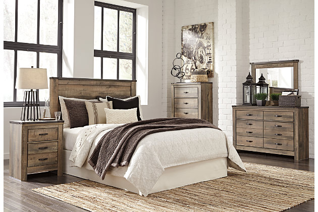 The Trinell panel headboard brings home a sense of authenticity. Rustic finish, plank-style details and nailhead trim pay homage to reclaimed barn wood, ma for a chic look loaded with charm. Mattress available, sold separately.Headboard only | Made of engineered wood and decorative laminate | Warm rustic plank finish over replicated oak grain and authentic touch | Nailhead accents | ¼” bolts (not included) are needed to attach headboard to existing bed frame | Bolt (not included) length depends on the thickness of your bed frame | Assembly required