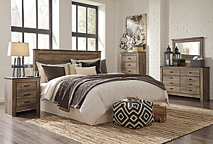 The Trinell king panel headboard brings home a sense of authenticity. Rustic finish, plank-style details and nailhead trim pay homage to reclaimed barn wood, making for a chic look loaded with charm. Mattress available, sold separately.Headboard only | Made of engineered wood (MDF/particleboard) and decorative laminate | Warm rustic plank finish over replicated oak grain and authentic touch | Nailhead accents | ¼” bolts (not included) are needed to attach headboard to existing bed frame | Bolt (not included) length depends on the thickness of your bed frame | Assembly required