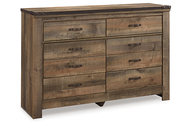 Whether she loves horses or he's a cowboy at heart, the Trinell dresser matches their authenticity. Rustic finish, plank-style details and nailhead trim pay homage to reclaimed barn wood, making for a chic look loaded with charm. Six roomy drawers keep clothing or toys nicely reined in.Dresser only | Made of engineered wood (MDF/particleboard) and decorative laminate | Warm rustic plank finish over replicated oak grain and authentic touch | Antiqued bronze-tone hardware | 6 smooth-operating drawers | Nailhead accents | Safety is a top priority, clothing storage units are designed to meet the most current standard for stability, ASTM F 2057 (ASTM International) | Drawers extend out to accommodate maximum access to drawer interior while maintaining safety | Assembly required