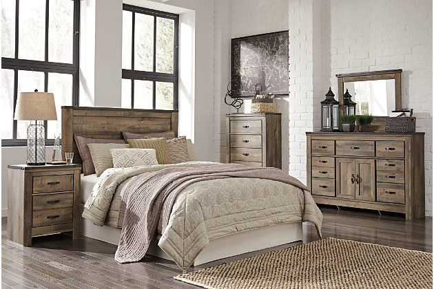 The Trinell queen panel headboard brings home a sense of authenticity. Rustic finish, plank-style details and nailhead trim pay homage to reclaimed barn wood, making for a chic look loaded with charm. Mattress available, sold separately.Headboard only | Made of engineered wood (MDF/particleboard) and decorative laminate | Warm rustic plank finish over replicated oak grain and authentic touch | Nailhead accents | ¼” bolts (not included) are needed to attach headboard to existing bed frame | Bolt (not included) length depends on the thickness of your bed frame | Assembly required
