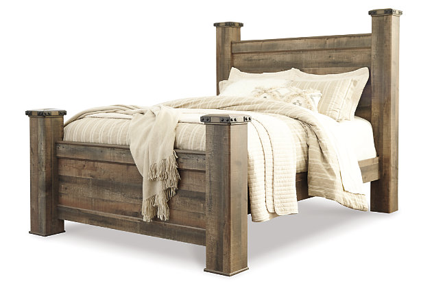 Giddy up your style. If you’re a cowboy or cowgirl at heart, the Trinell queen poster bed matches your authentic sense of taste. Rustic finish, plank details and nailhead trim are an homage to reclaimed barn wood, making for a sophisticated look loaded with countrified charm. Mattress and foundation/box spring available, sold separately.Includes headboard, footboard, posts and rails | Made of engineered wood (MDF/particleboard) and decorative laminate | Warm rustic plank finish over replicated oak grain and authentic touch | Foundation/box spring required, sold separately | Mattress available, sold separately | Assembly required | Estimated Assembly Time: 15 Minutes