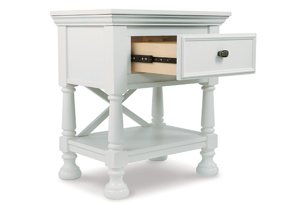 Let your country cottage style shine through with the crisp and cheerful Kaslyn nightstand. The clean lines, stylish half-round pilasters and signature "X" motif are classic elements that flow beautifully with cottage-quaint and shabby chic aesthetics.Turned bun feet | Made of veneers, wood and engineered wood | Assembly required | Top drawer with felt bottom | 1 smooth-operating drawer with dovetail construction | Fixed shelf | Aged nickel-tone hardware | Estimated Assembly Time: 15 Minutes