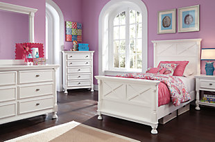 Let your country cottage style shine through with the crisp and cheerful Kaslyn chest of drawers. The clean lines are enhanced with refined details such as classic half-round pilasters and beautifully turned bun feet. Five smooth-gliding drawers easily accommodate your wardrobe needs.Made of veneers, wood and engineered wood | 5 smooth-operating drawers with dovetail construction | Top drawer with felt bottom | Aged nickel-tone hardware | Turned bun feet | Estimated Assembly Time: 15 Minutes