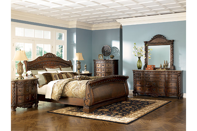 Inspired by the grandeur and grace of Old World traditional style, the North Shore California king sleigh bed is nothing short of stunning. A choice blend of materials is accented by detailed ornamental appliques. Graceful curves of the sleigh design are the essence of romance. Mattress available, sold separately.Made of veneers, wood, engineered wood and cast resin | Assembly required | Foundation/box spring required, sold separately | Mattress available, sold separately | Estimated Assembly Time: 10 Minutes