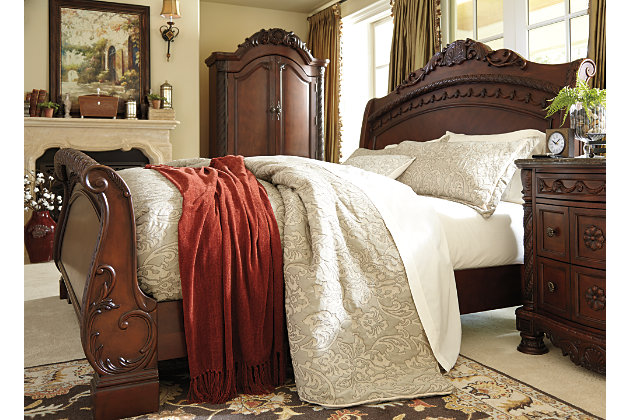 Inspired by the grandeur and grace of Old World traditional style, the North Shore California king sleigh bed is nothing short of stunning. A choice blend of materials is accented by detailed ornamental appliques. Graceful curves of the sleigh design are the essence of romance. Mattress available, sold separately.Made of veneers, wood, engineered wood and cast resin | Assembly required | Foundation/box spring required, sold separately | Mattress available, sold separately | Estimated Assembly Time: 10 Minutes
