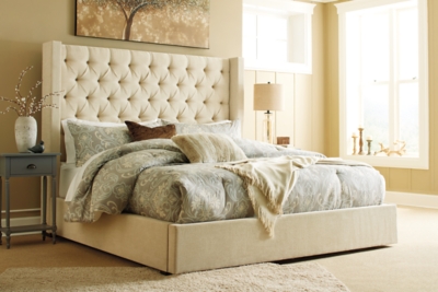 cream upholstered queen bed