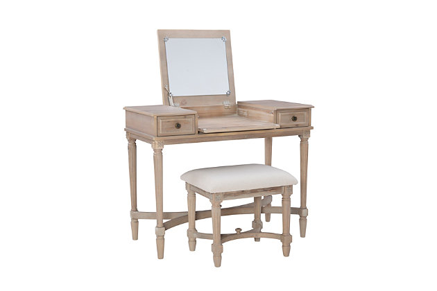 Dressed to impress with fluted legs, curved X stretchers and framed drawer fronts, this vanity set is such a delightful choice for a teen’s room, master bedroom or dressing area. Its soothing gray washed finish gives the classic styling a fresh sensibility that feels here and now. Given its clever flip-top design with hidden mirror and storage space, this vanity set works equally well as a compact desk. The matching upholstered seat completes the picture-perfect look.Made of wood and engineered wood | Gray washed finish | Flip top with safety hinge reveals mirror and open storage | 2 smooth-gliding drawers | Brass-tone metal pulls | Foam padded seat with beige microfiber upholstery | Assembly required